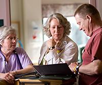 Nurses reviewing patient charts