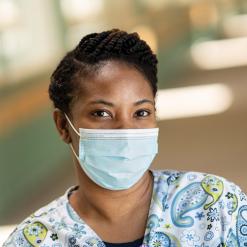 Female healthcare provider with mask.